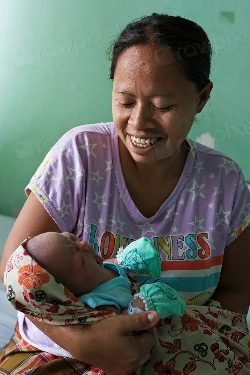 A mother holding her newborn